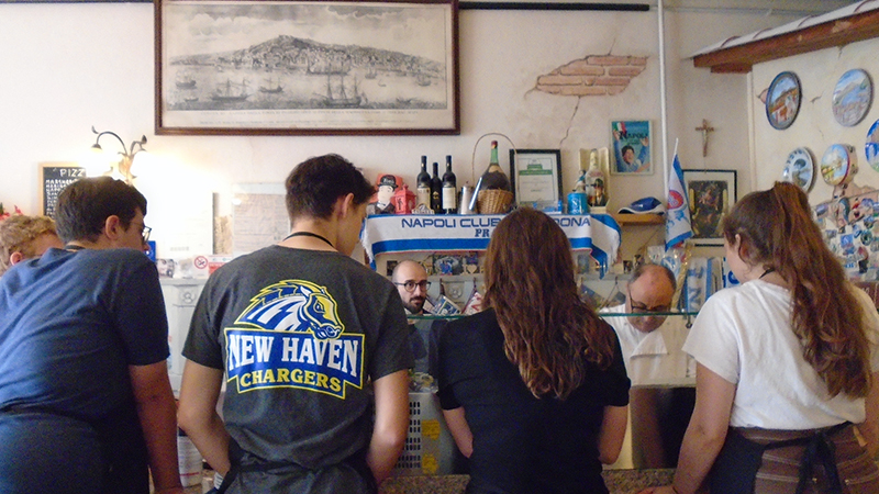 Students enjoy a private pizza making lesson at Pizland in Prato, Italy.