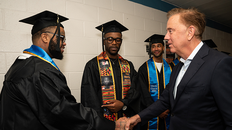 Gov. Ned Lamont congratulates Alpha Jalloh. 