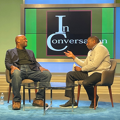 Prof. Wayne Edwards (right) leads a conversation as part of the fellowship event.