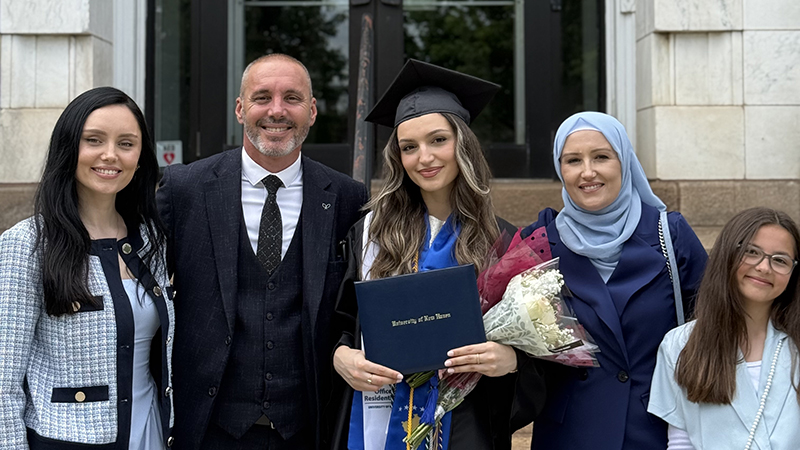 Esma Fera ’25 (center) and family.
