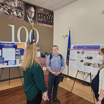 Dr. Karl Minges, chair of the Health Administration and Policy Department, at the showcase.