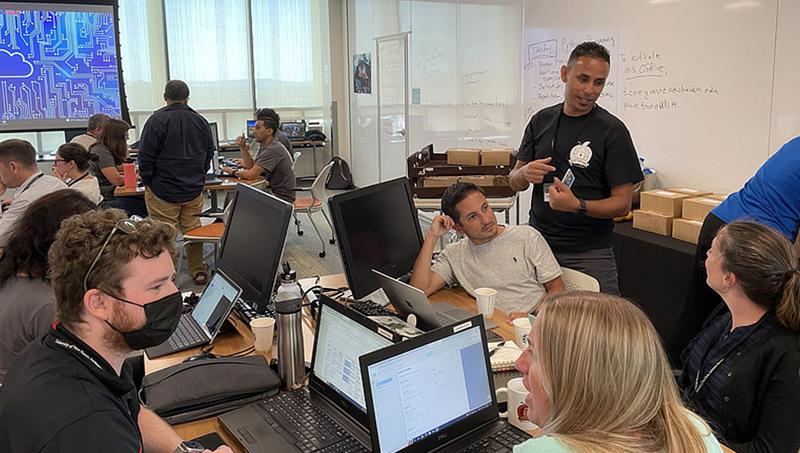 Dr. Mehdi Mekni (standing) with educators at the inaugural GenCyber Teacher Academy. 