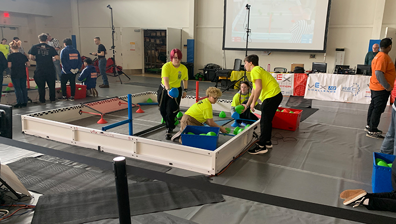 Students working together on a robot.