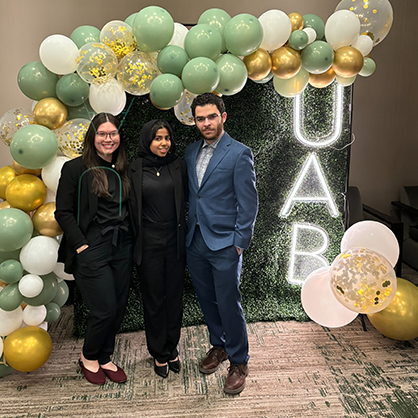 Maria Latta ’24 MHA (left), Hiba Jaidi ’25 MHA (center), and Jose Perez MHA at the competition. 