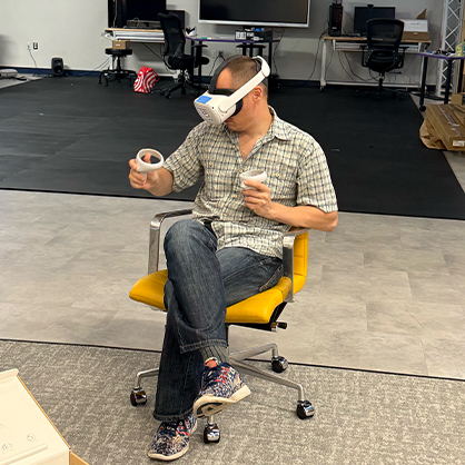 Dr. Boduliev explores virtual reality technology during his visit to a research lab in New Haven