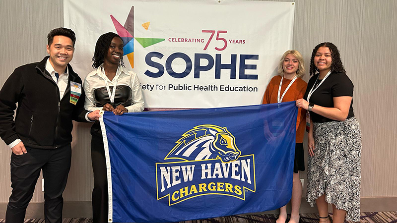 (left to right) Alvin Tran, ScD, MPH, Edna Agyeman ’26, Serenity Roberts ’26, and Kayla Batista ’26.