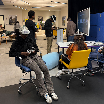 Zintombizodwa Dube ’27 MPH, on the left, plays Invite Only VR, a virtual reality game developed and evaluated as a vaping prevention intervention for adolescents