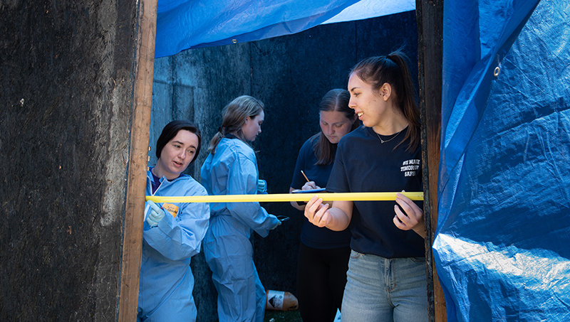 Students investigate a mock meth lab.