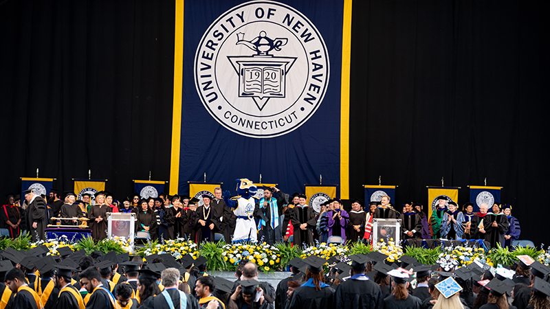 Charlie helps welcome the Class of 2023 to Commencement.