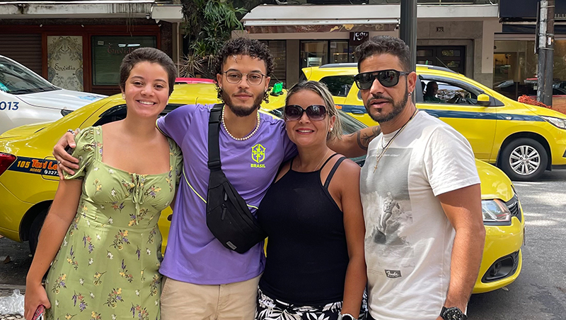 Julia Clara Ferreira ’27 (left) with her brother Lucas and their parents Cyntia and Julio.