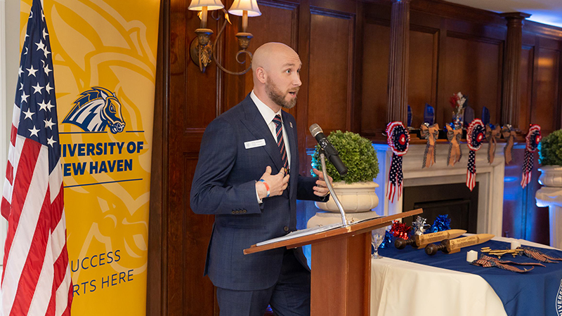 Ryan Noonan '20, '23 M.S. addresses attendees during the ceremony.