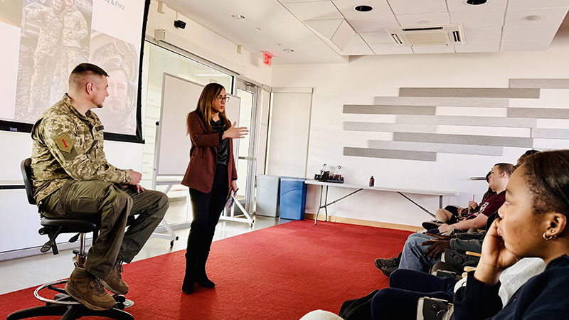 Sr. Lt. Mykola Melnyk meeting with students, with Dr. Olena Lennon, a National Security professor, translating from Ukrainian into English.
