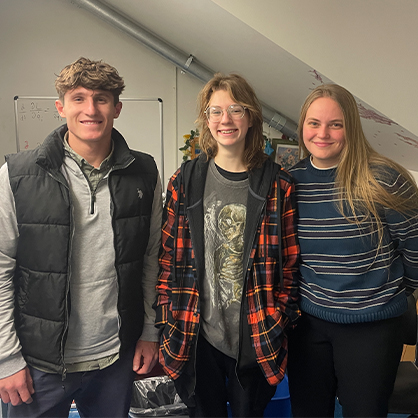 Physics LA mentor Monica Kacynski ’25, ’26 M.S.  shares strategies and support with mentees Daniel Folloni '26 and Caitlyn Morris '27, '28 M.S.