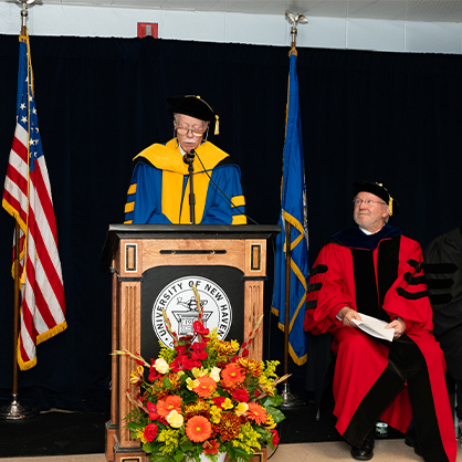 Board of Governors member Philip Bartels ’11 Hon. addresses the graduates before formally conferring their degrees on behalf of the University of New Haven
