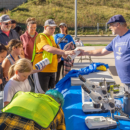 Dr. Jean-Paul Simjouw, Ph.D. (right), an environmental science and marine biology lecturer, with participants.