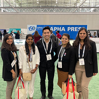 Dr. Alvin Tran (center) with students at the conference.