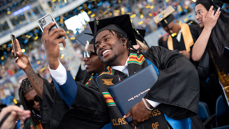 Members of the Class of 2023 celebrate together at the end of the ceremony.