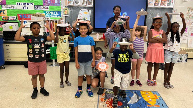 Brianna Myrie ’26 (back, center) worked with kids at the West Haven Community House.