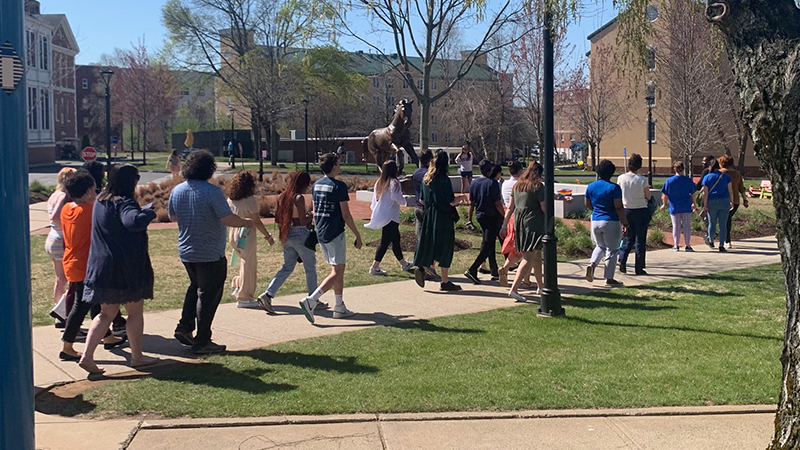 The event brought participants to the Charger statue.