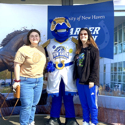 Gabby Pinto ’26 with Charlie and her mom when she visited campus for an admissions event