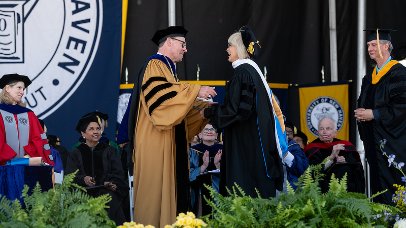 University President Jens Frederiksen, Ph.D., greets Ann Nyberg ’24 Hon.