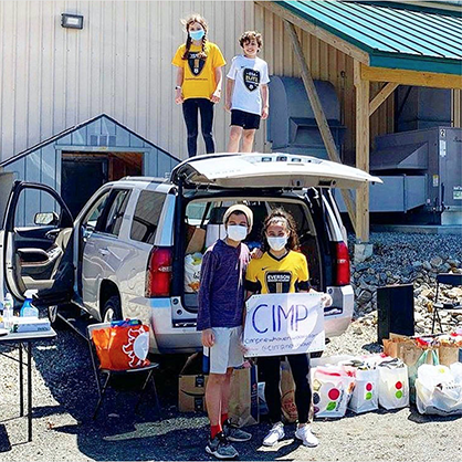 Students collecting items for food drive