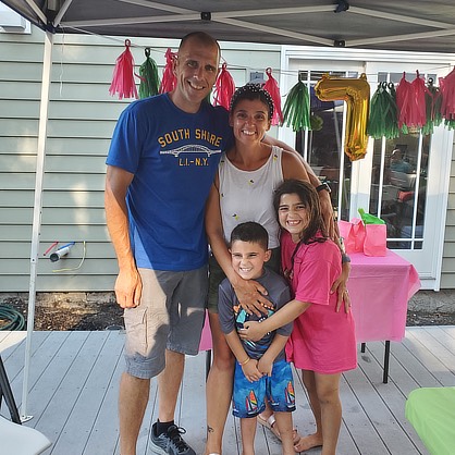 Image of Andrew and Connie Dinkel with their children Madalyn and Ean.