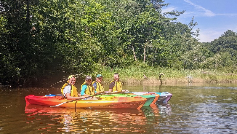 Image of Jill Banatoski and her family kayaking