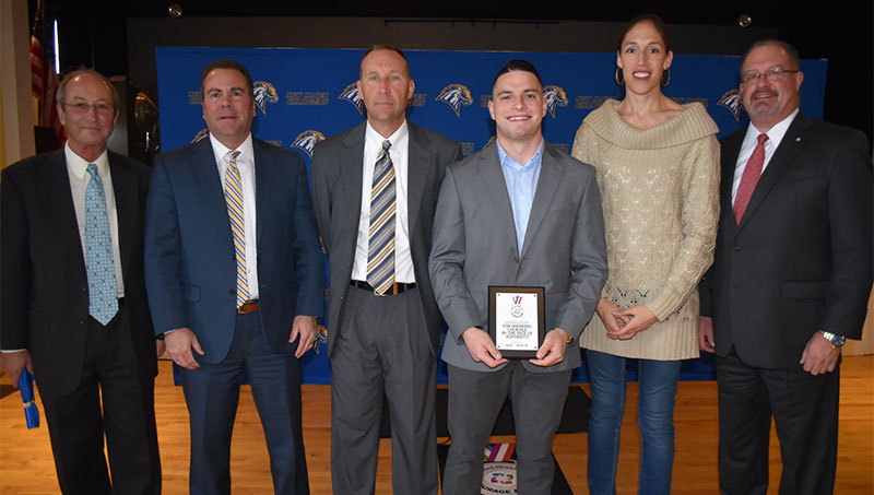 Image of Christopher Liggio ’20 and faculty.