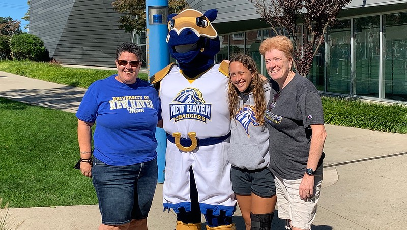 Charlie the Charger with a visiting family on family day.