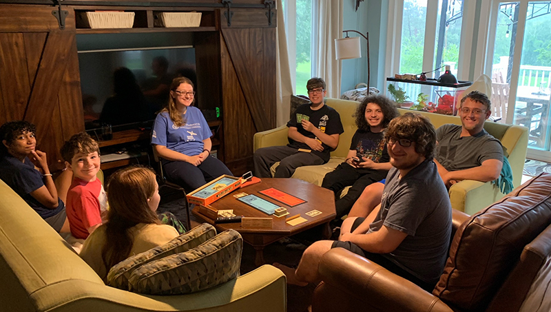 Michael Tirabassi (in brown chair) rode out the storm with several of his fellow Chargers.