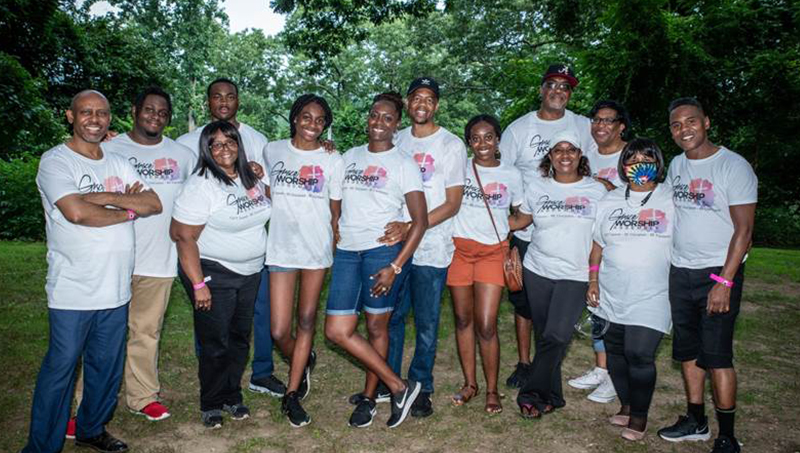 Linda Copney-Okeke and her “church family” pose for a photo.