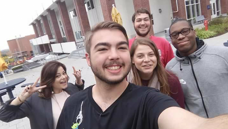 Valentina Seffer, Ph.D. (left), and students at the University’s main campus in West Haven.