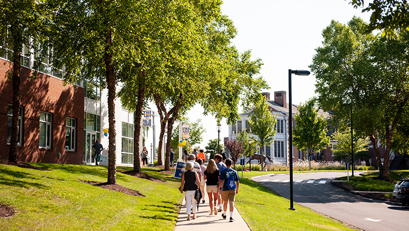 Families walking together on campus.