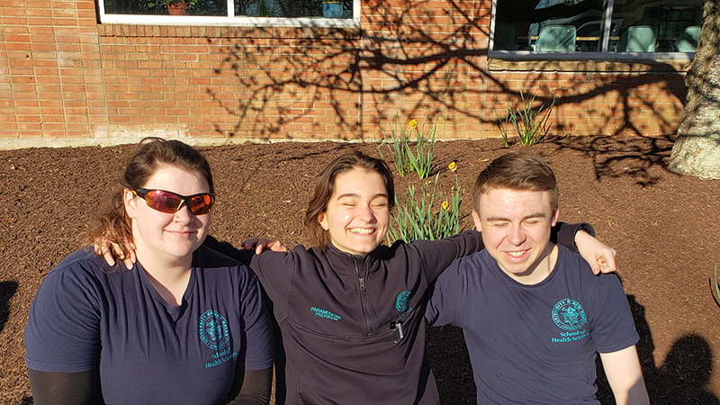 Beatrice Glaviano ’26 (center) with her classmates. 