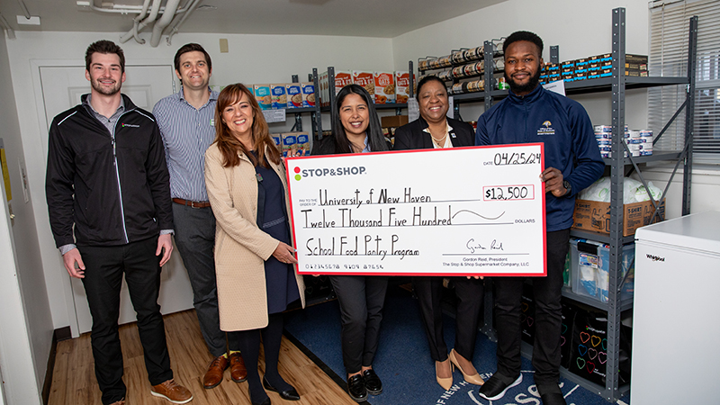 Chargers and representatives from Stop & Shop celebrated five years of partnering together to support the Campus Pantry.