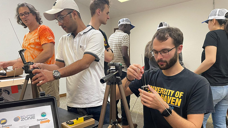 Kiefer Neumann ’23, ’24 M.S. (front) and his fellow researchers unpack their gear.