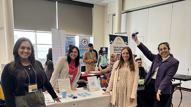 Baki Izzat (right) and industry professionals at the career expo.