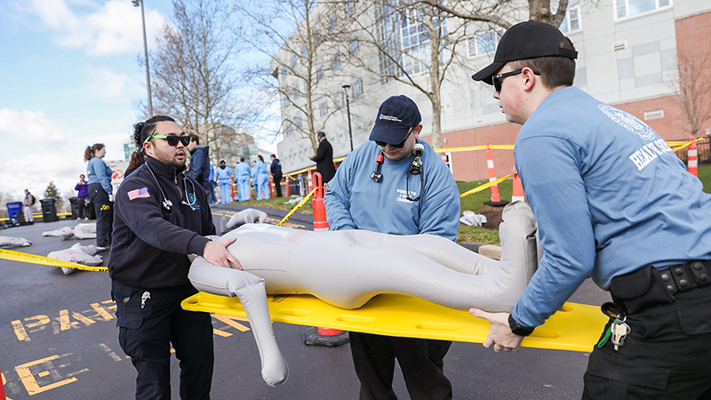 Paramedicine students respond to a mock emergency as part of the drill.