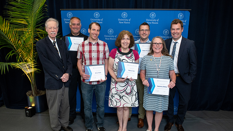 (L-R) Philip H. Bartels ’11 Hon., Brett Mahoney, Brian Wells, Helena Cole Robbie Ossenfort, Sadartha DiNello, President Jens Frederiksen, Ph.D.