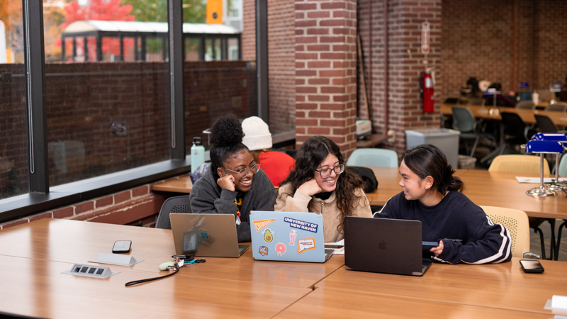 three students sit near each other in University of New Haven's Center for Learning Resources